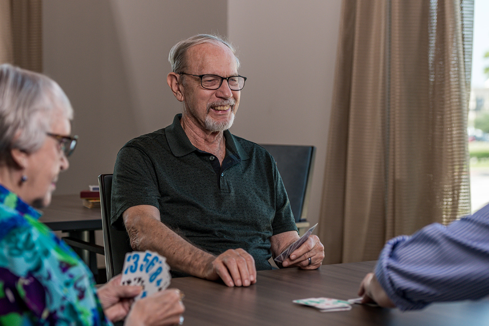 Older adults play cards